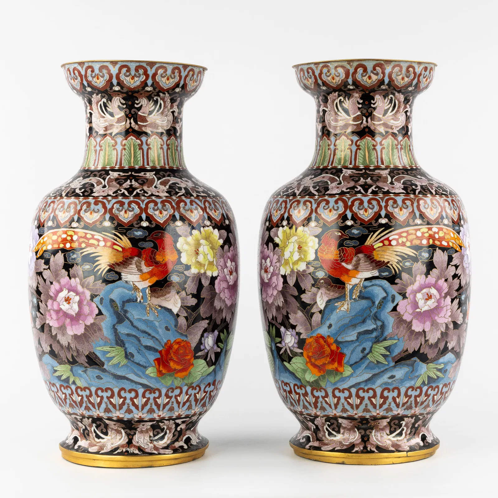 A Pair of large Oriental cloisonné vases with a floral and bird design. 20th C.