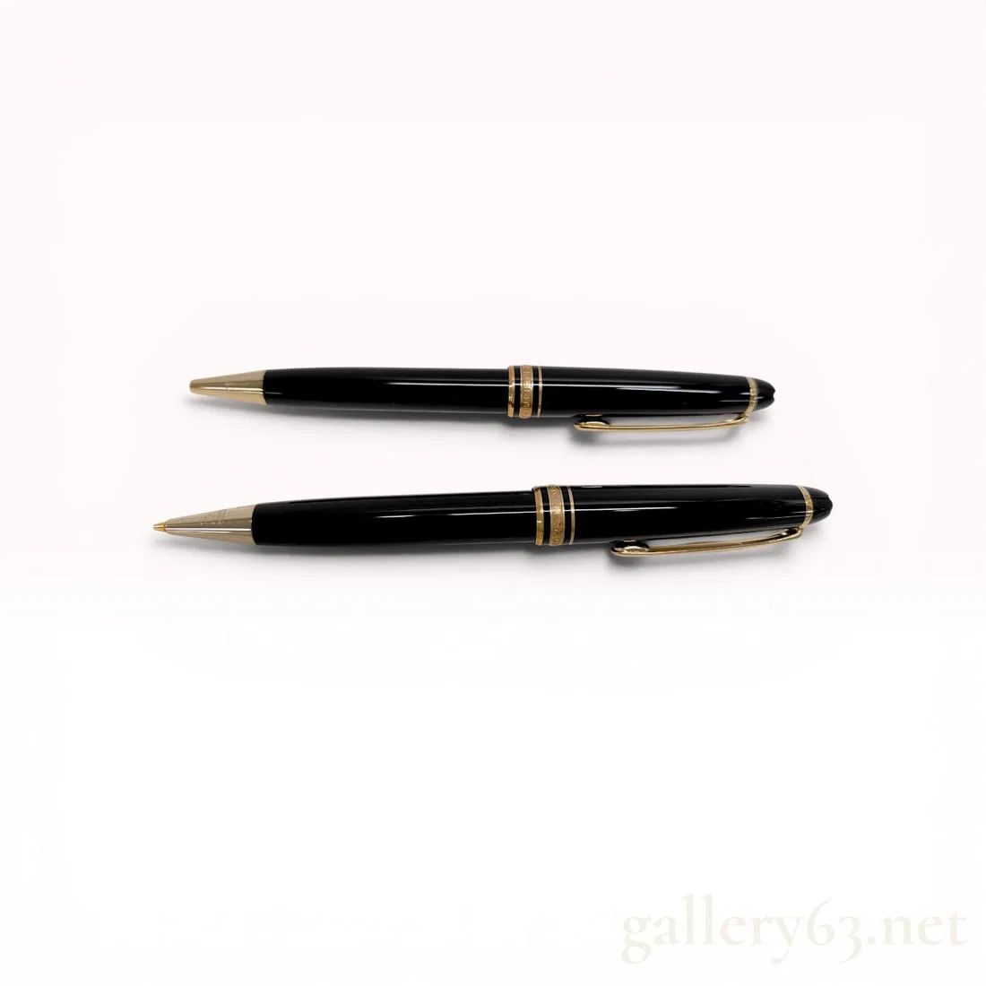 A Pair of Montblanc Meisterstuck Classique Gold-Coated Resin Writing Instruments