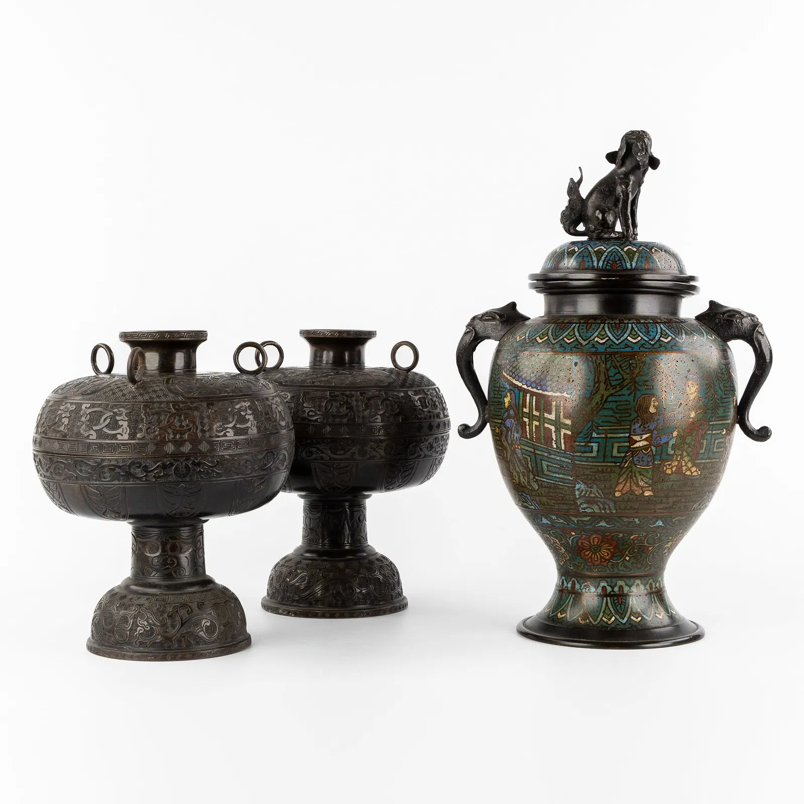 A Pair of Oriental bronze covered vases and a Champlevé covered vase, 19th/20th C.