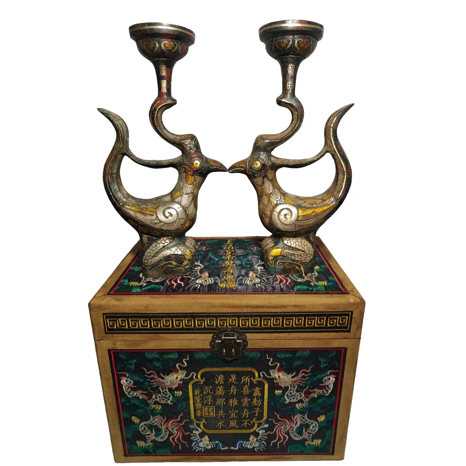 A pair of Qing Dynasty Qianlong period bronze candle holders.