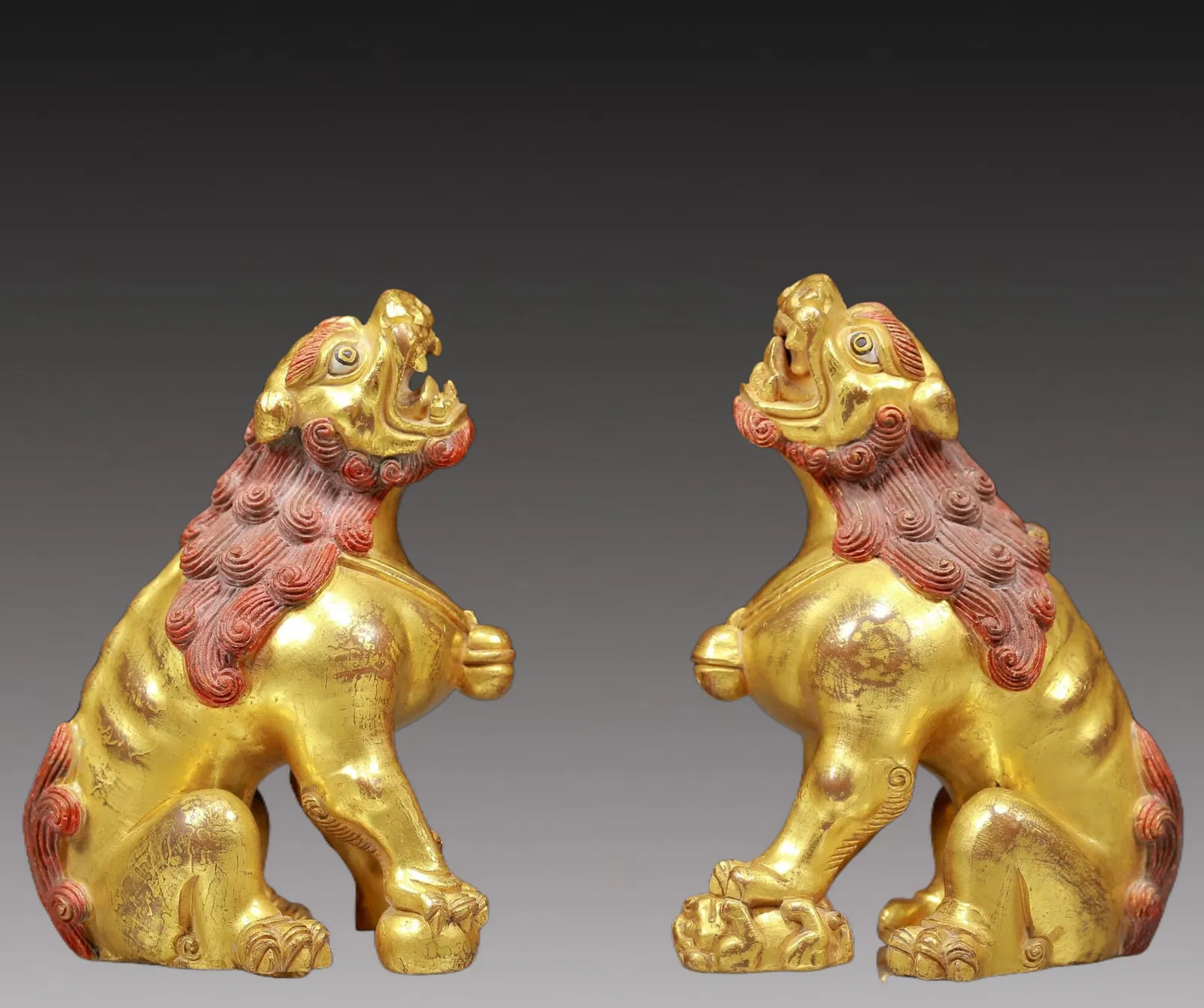 A Pair of Rare Gilt Bronze Lion Ornaments