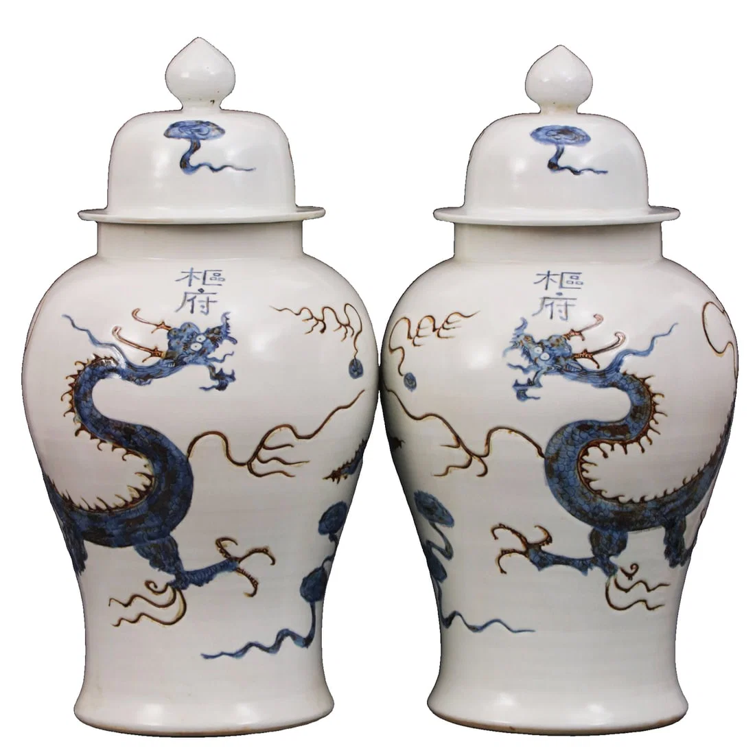 A pair of Yuan Dynasty blue and white generals' jars with underglaze red dragon design.