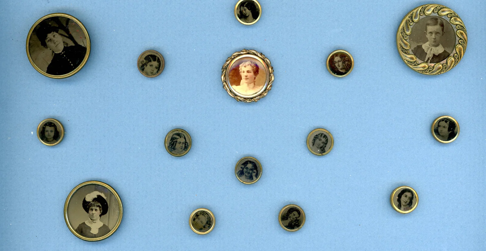 A PARTIAL CARD OF DIVISION 1 PHOTOGRAPHIC BUTTONS