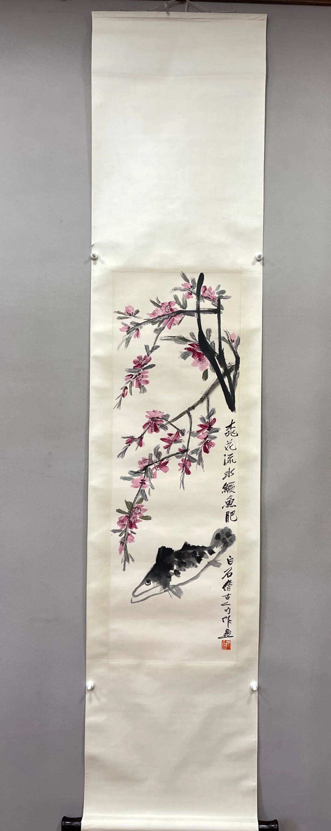 A picture of Qi Baishi's peach blossom mandarin fish