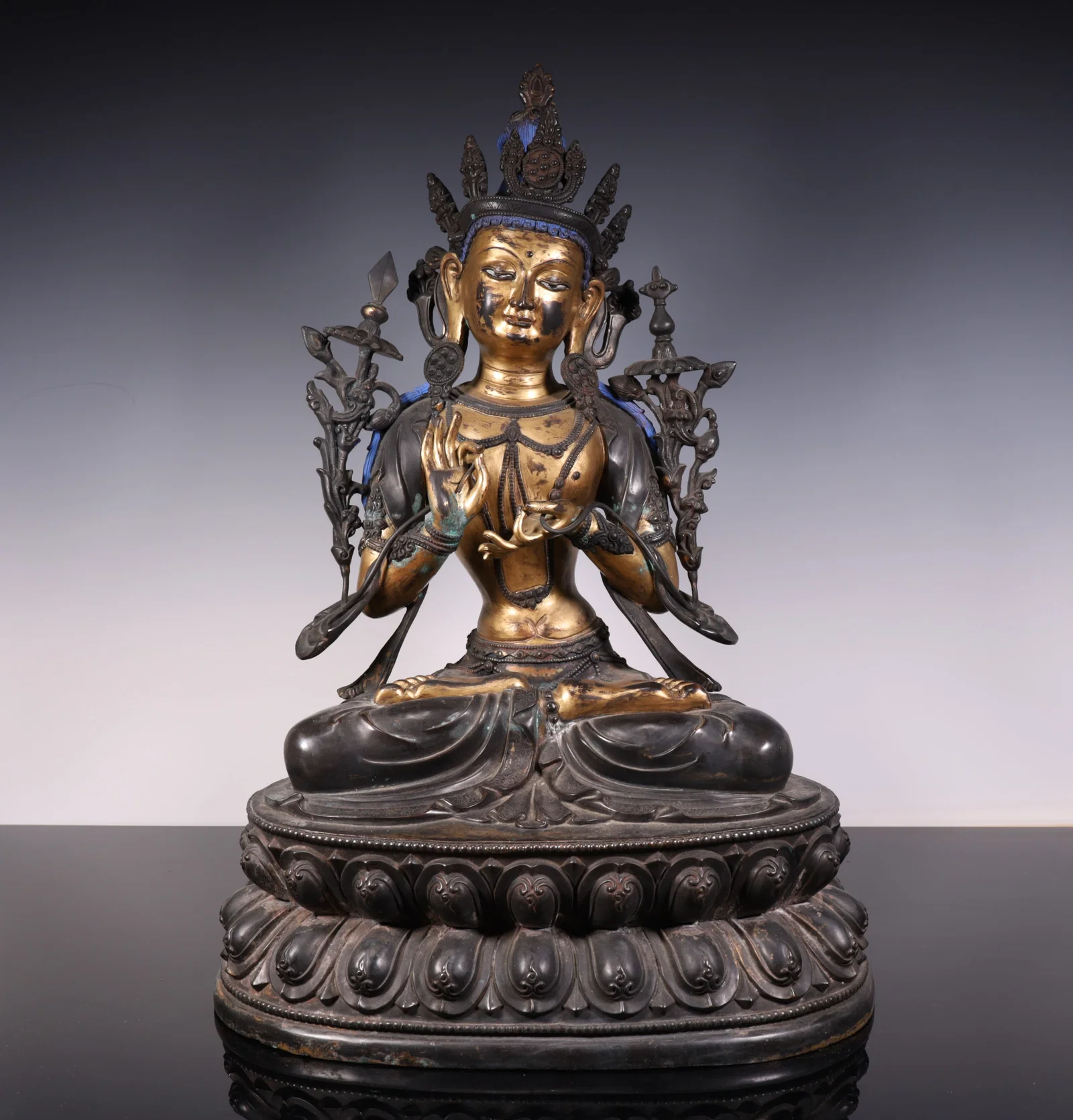 A piece of copper-gilt green Tara
