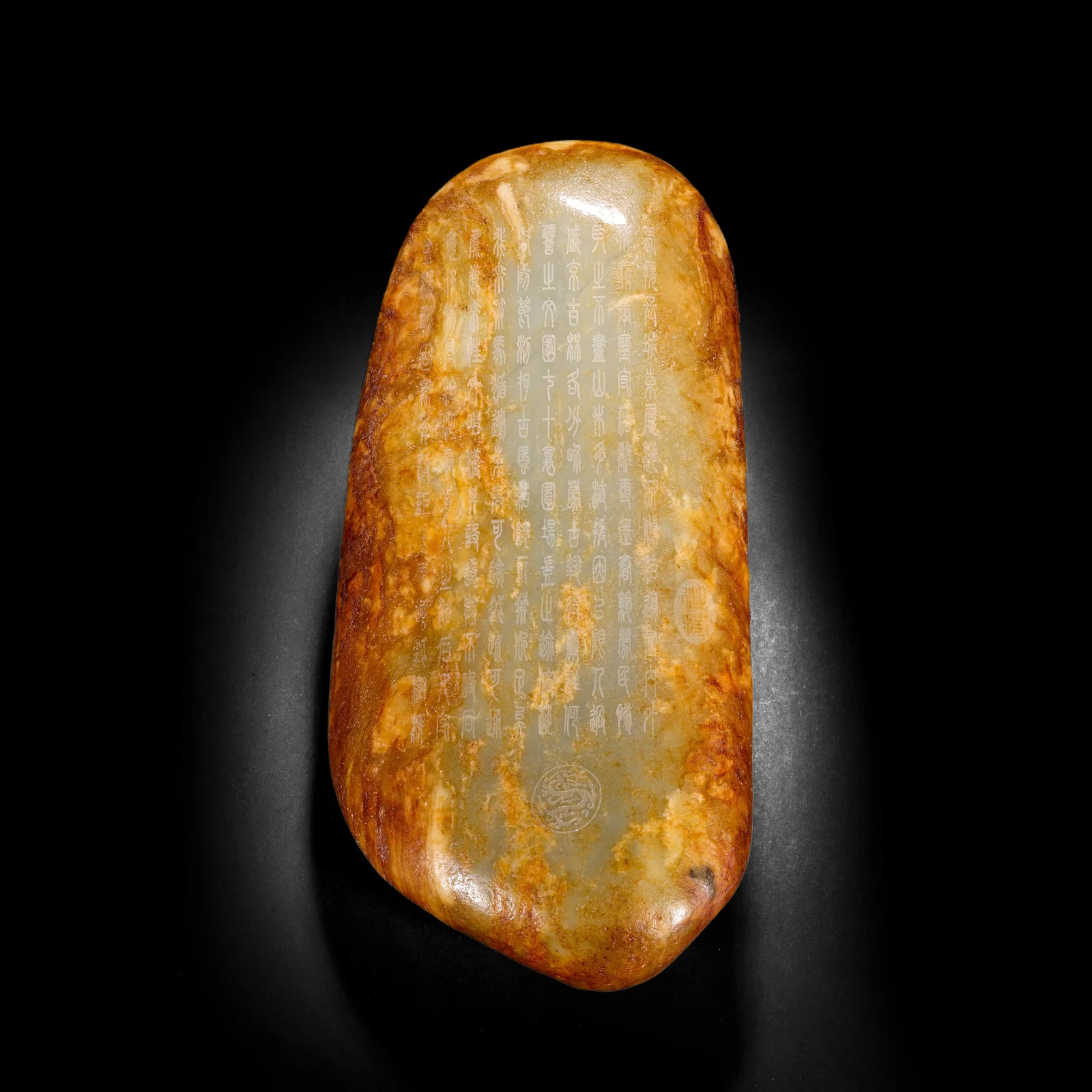 A PIECE OF HETIAN JADE SEED MATERIAL FROM THE QING DYNASTY ENGRAVED WITH THE SKIN FOR POETRY AND
