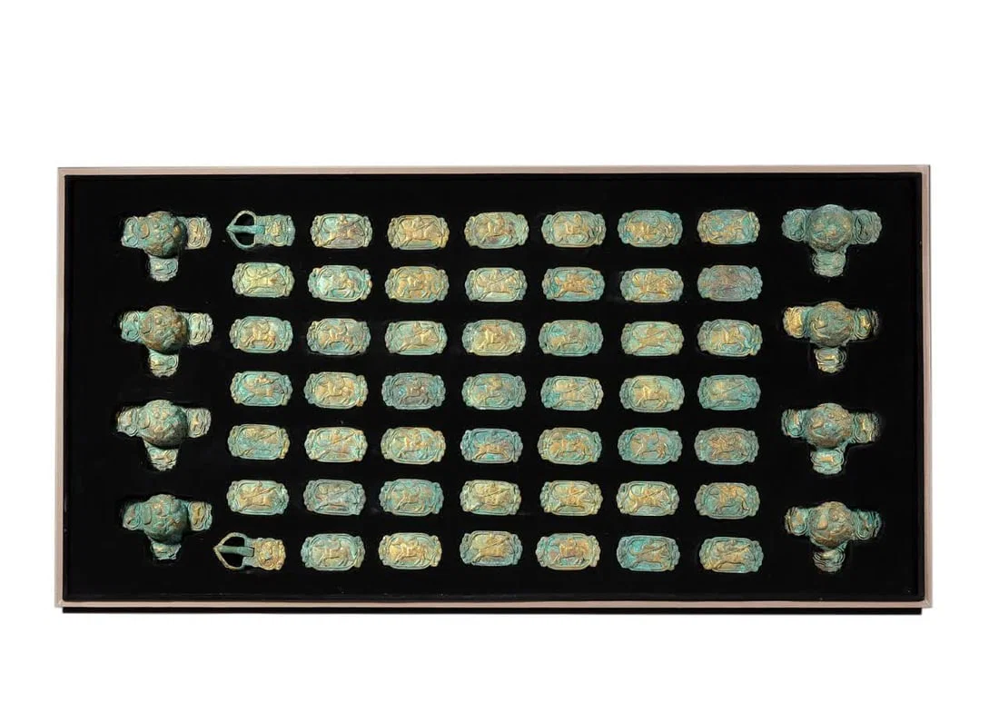 A piece of Liao Dynasty copper gilt harness belt decoration single piece long