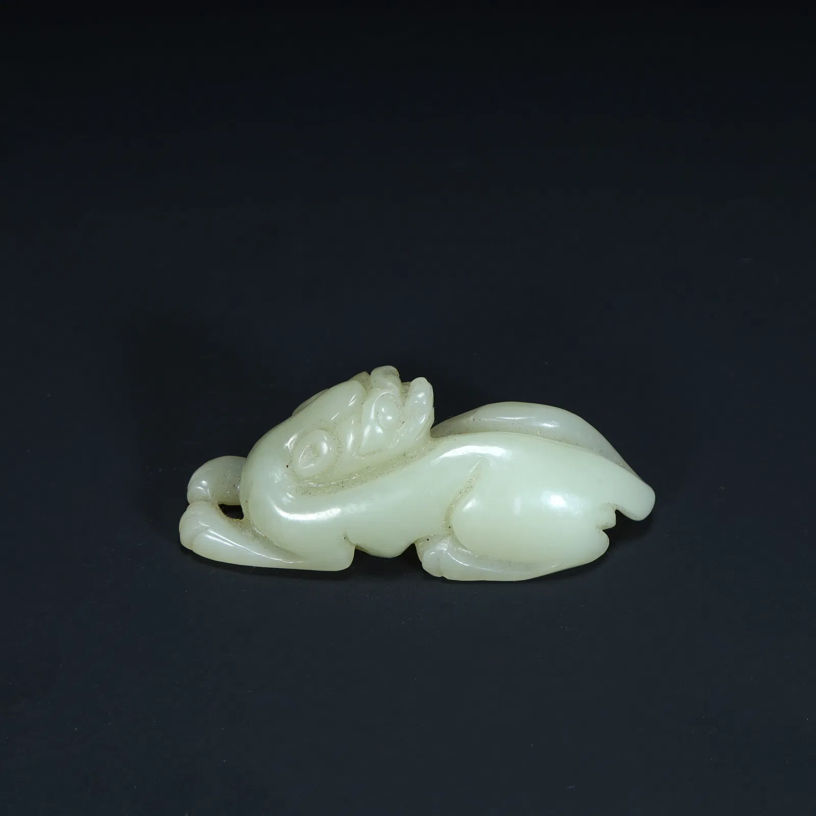 A piece of Qing Dynasty Hetian jade auspicious beast (Pixiu).