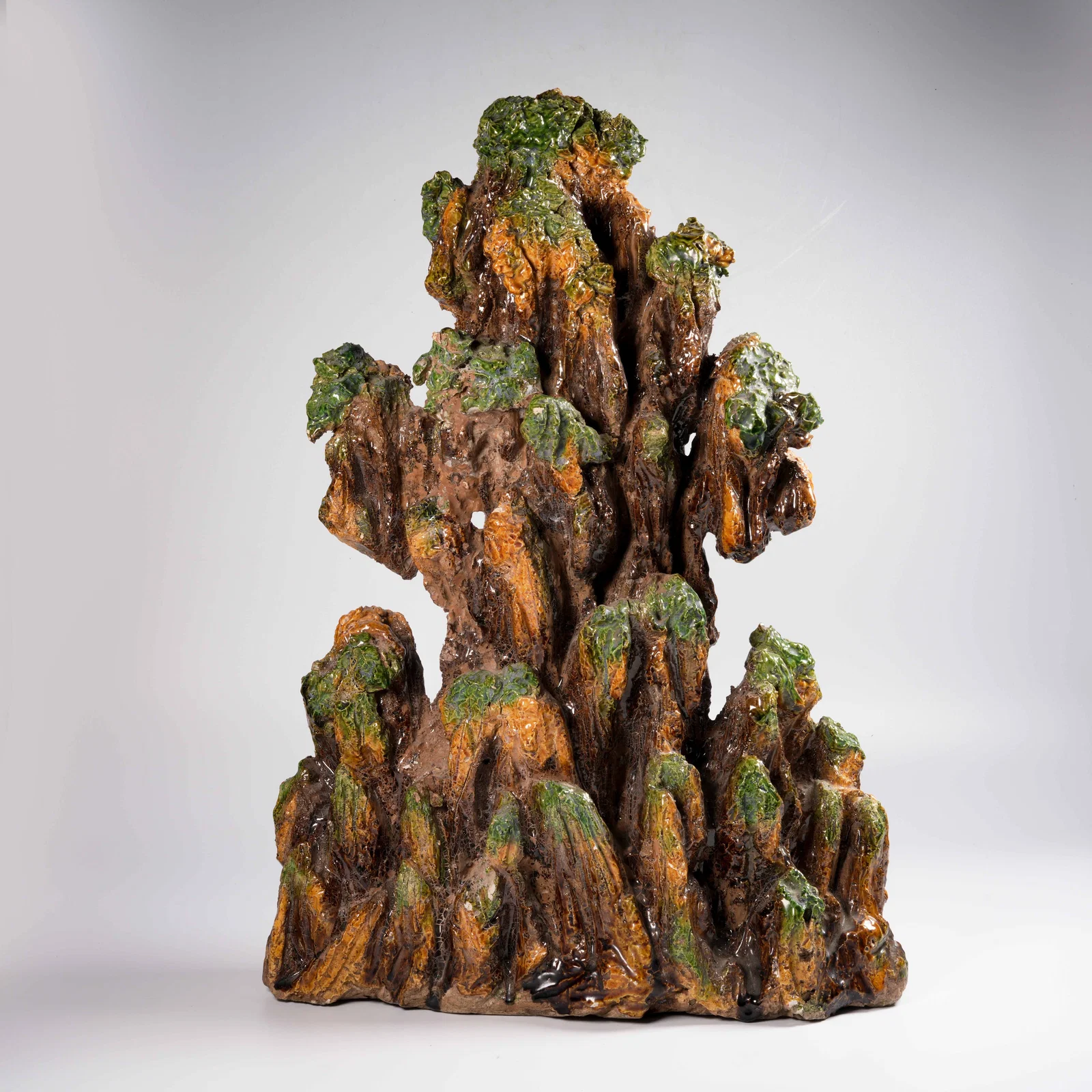 A PLAIN SANCAI MOUNTAIN-FORM ORNAMENT