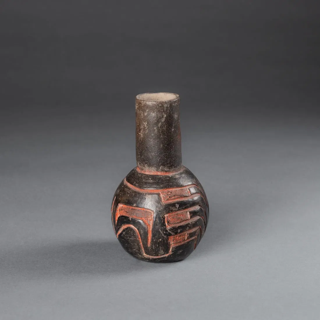 A Pre-Columbian blackware incised vase