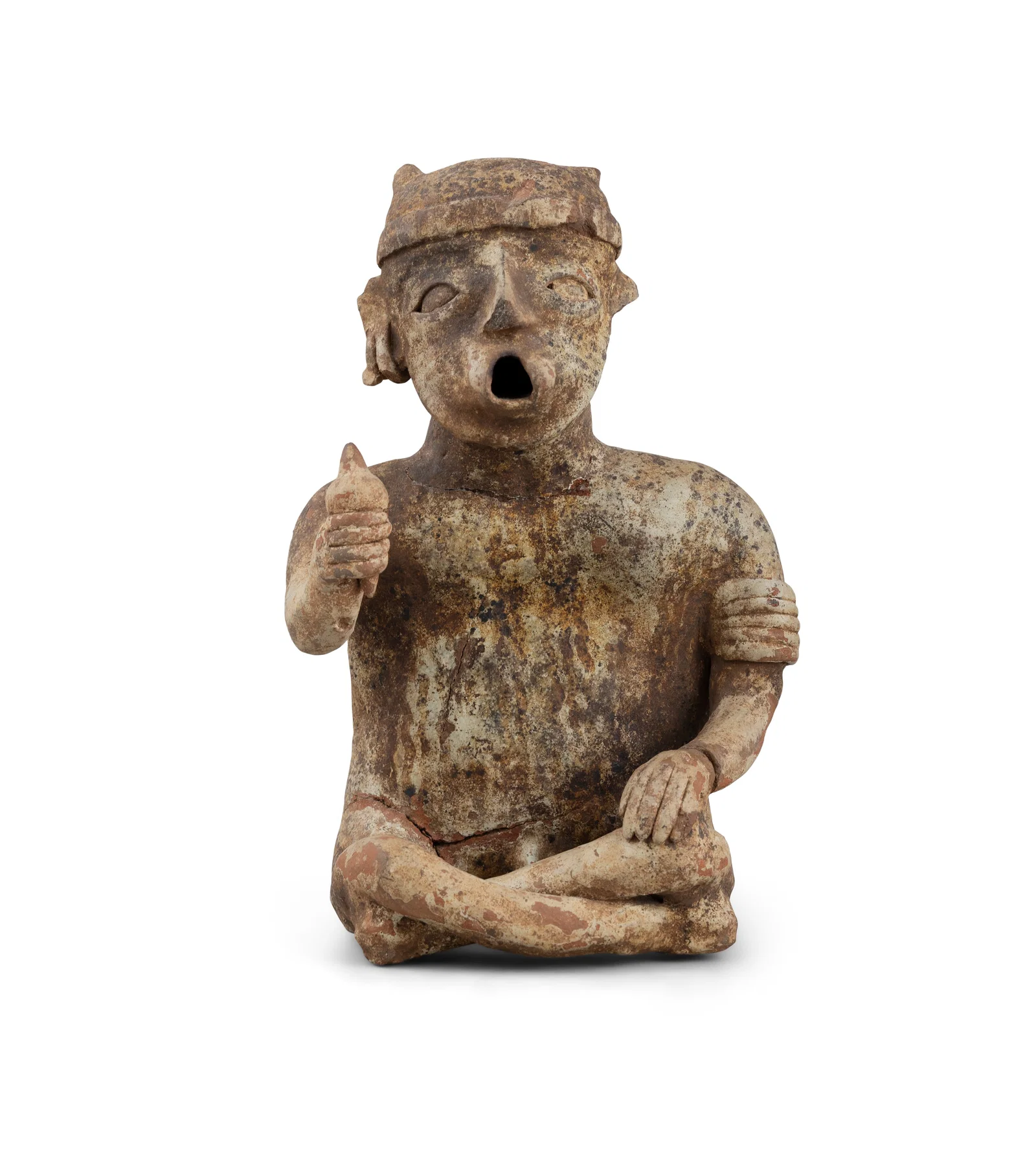 A PRE-COLUMBIAN TERRACOTTA SEATED MALE FIGURE in a crossed leg pose, with opening at the mouth,