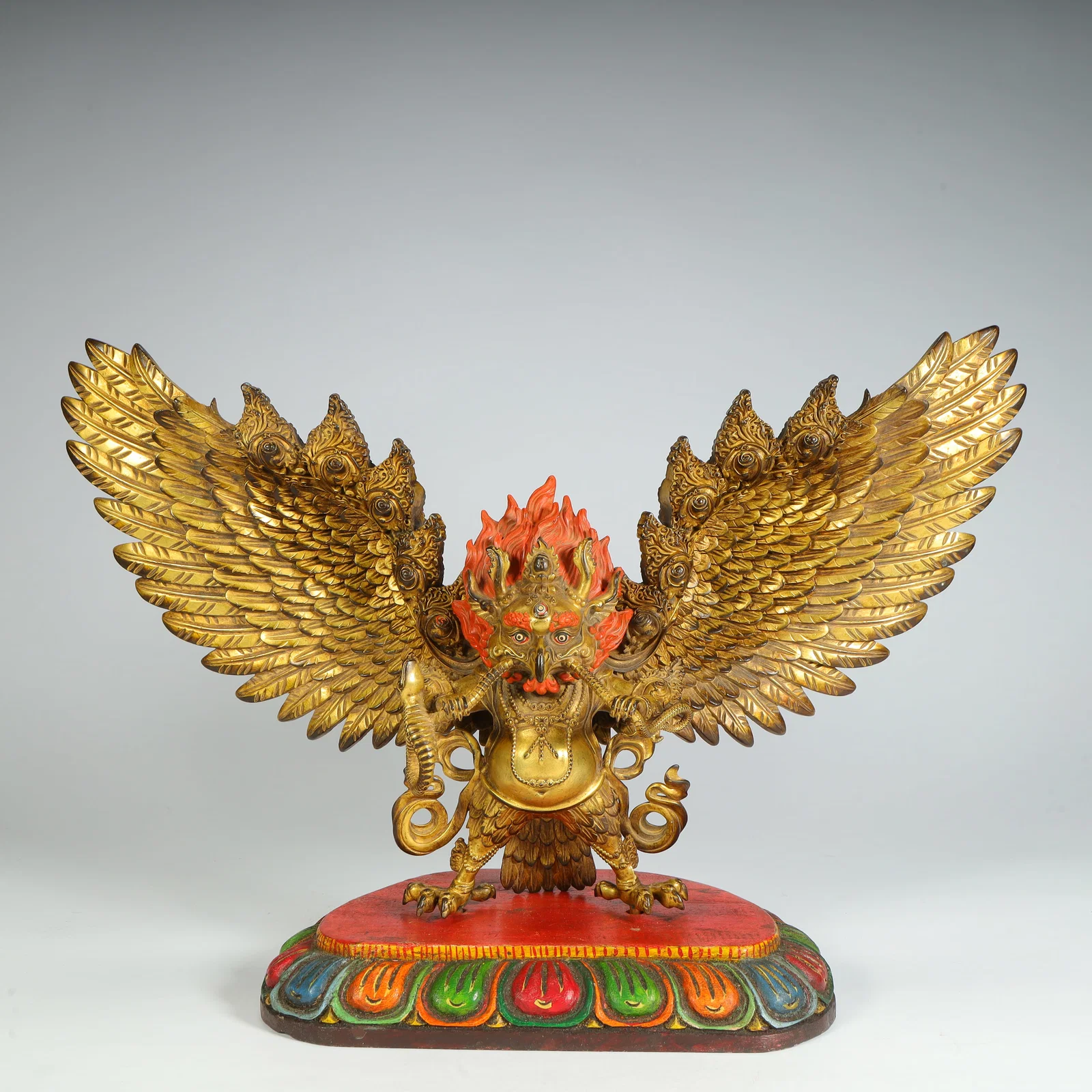 A Qing Dynasty bronze gilt roc golden-winged bird Garuda statue