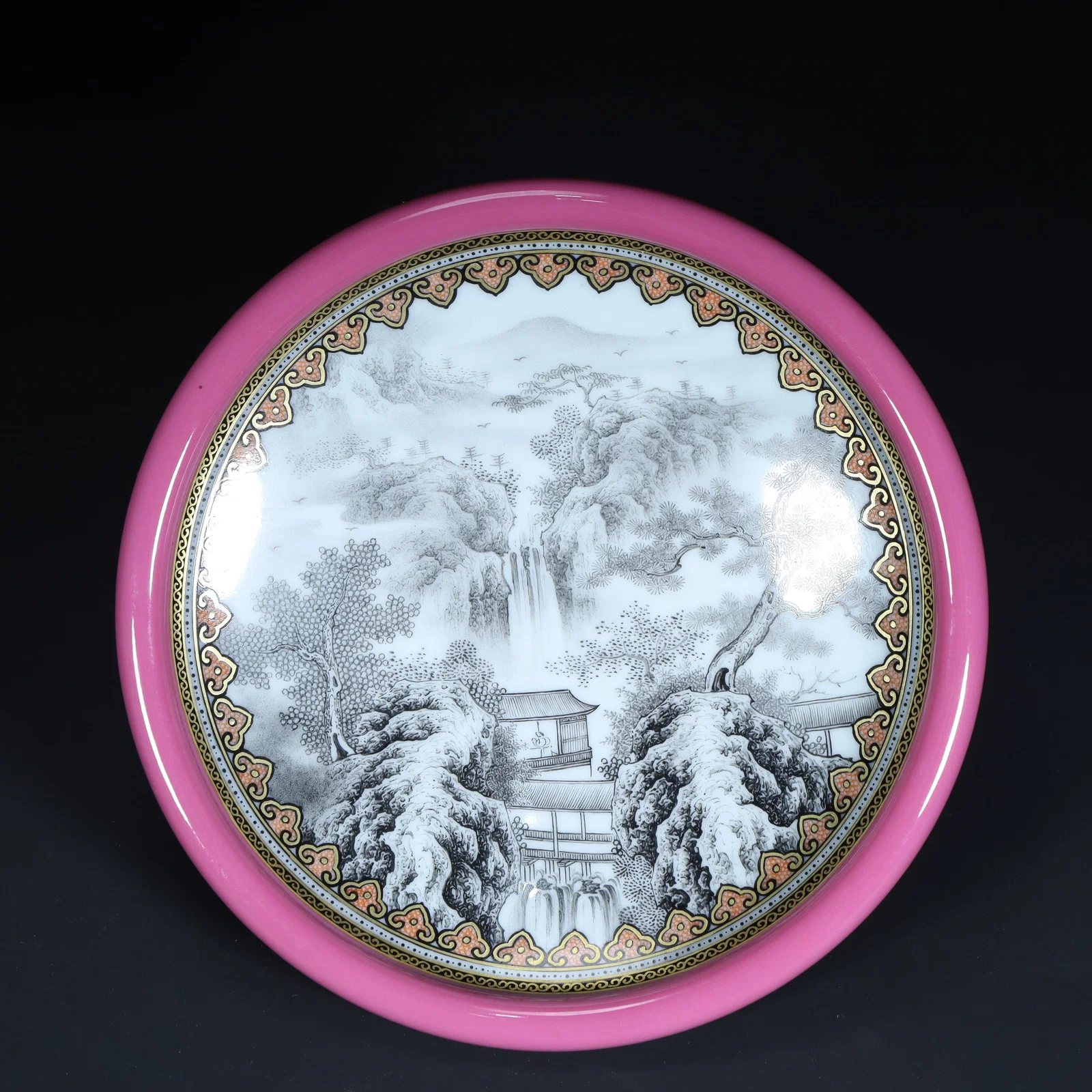 A Qing Dynasty carmine red ground ink color landscape pavilion pattern