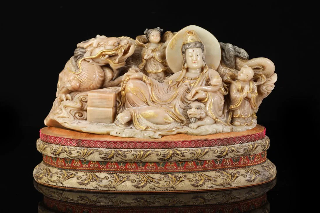 A Qing Dynasty Shoushan stone Guanyin carving is still even
