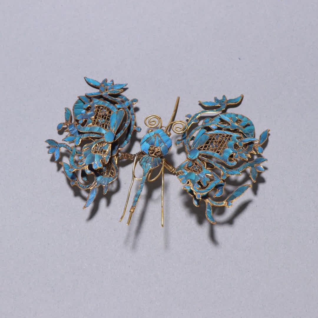 A Qing Dynasty silver-gilt emerald butterfly hairpin