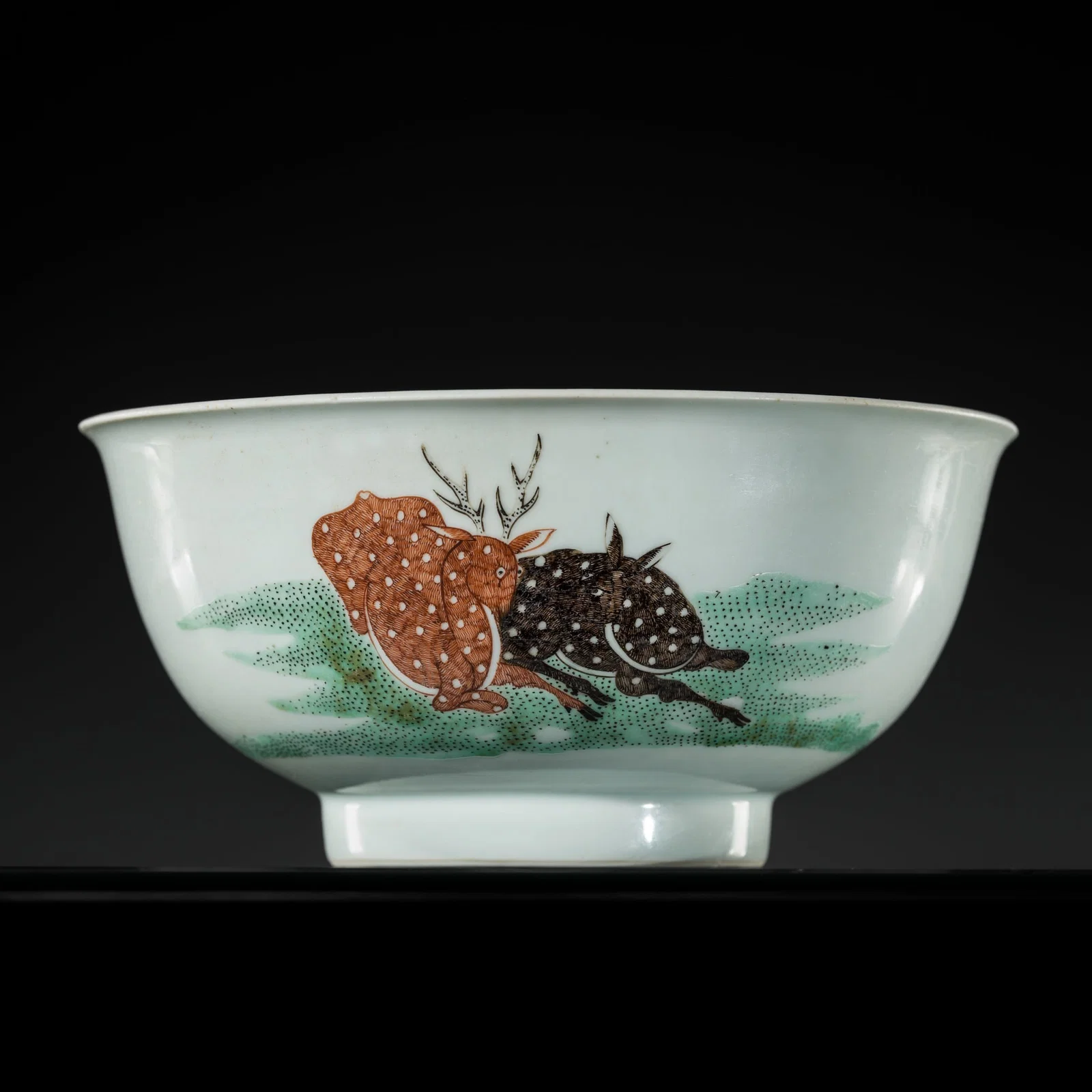 A RARE AND CHARMING 'SPOTTED DEER AND BATS' BOWL, LATE KANGXI TO YONGZHENG PERIOD