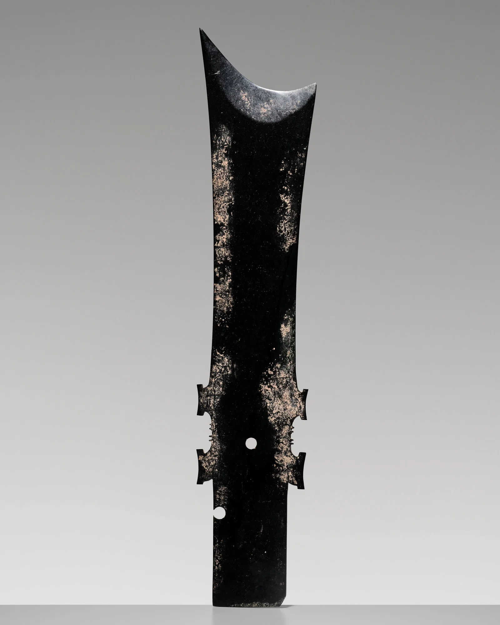 A RARE AND EXCEPTIONALLY LARGE (68 CM) DARK GREEN JADE CEREMONIAL BLADE, YAZHANG, WESTERN ZHOU
