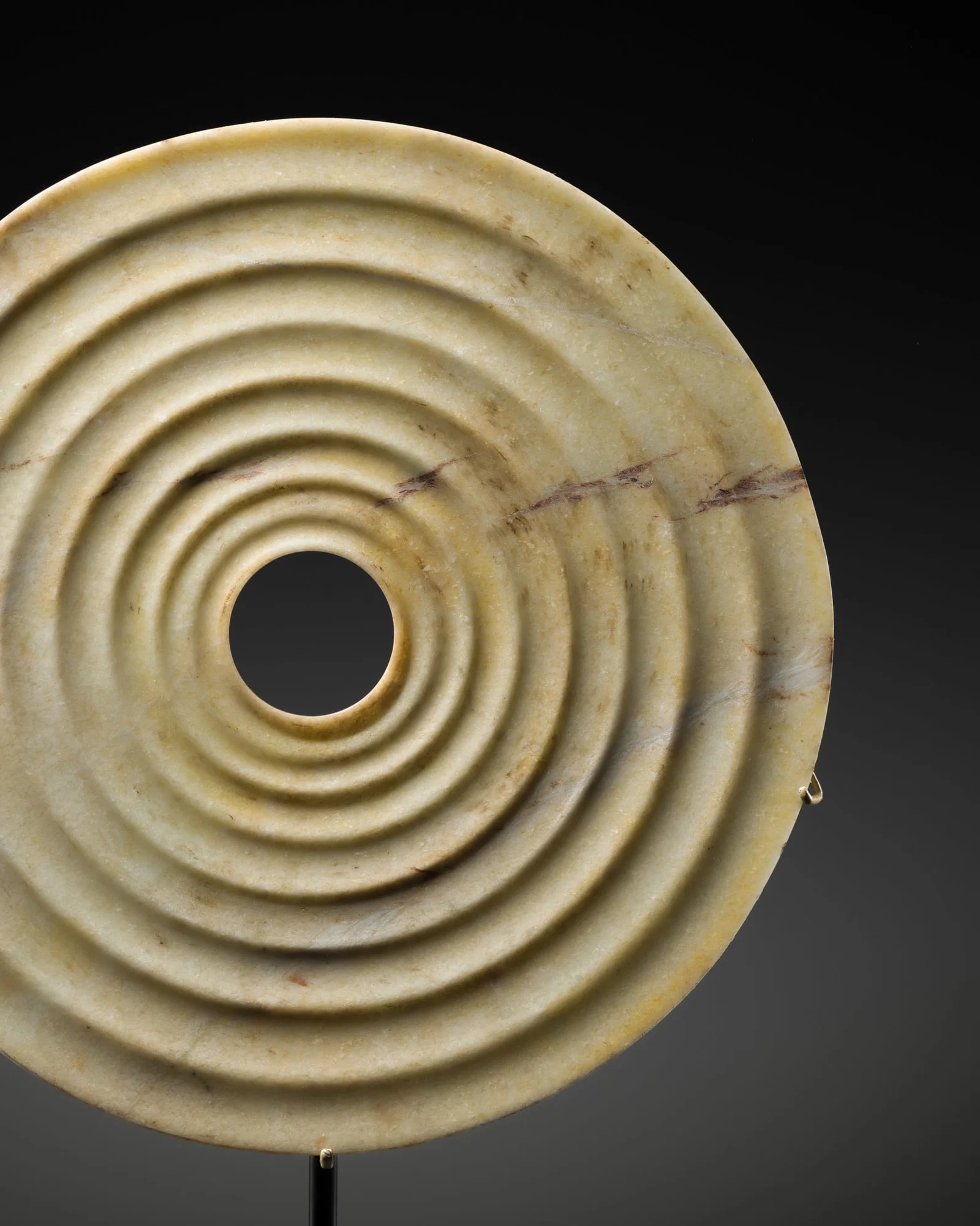 A RARE AND LARGE (34.4 CM) YELLOW JADE RIBBED DISK, BI, SHANG DYNASTY