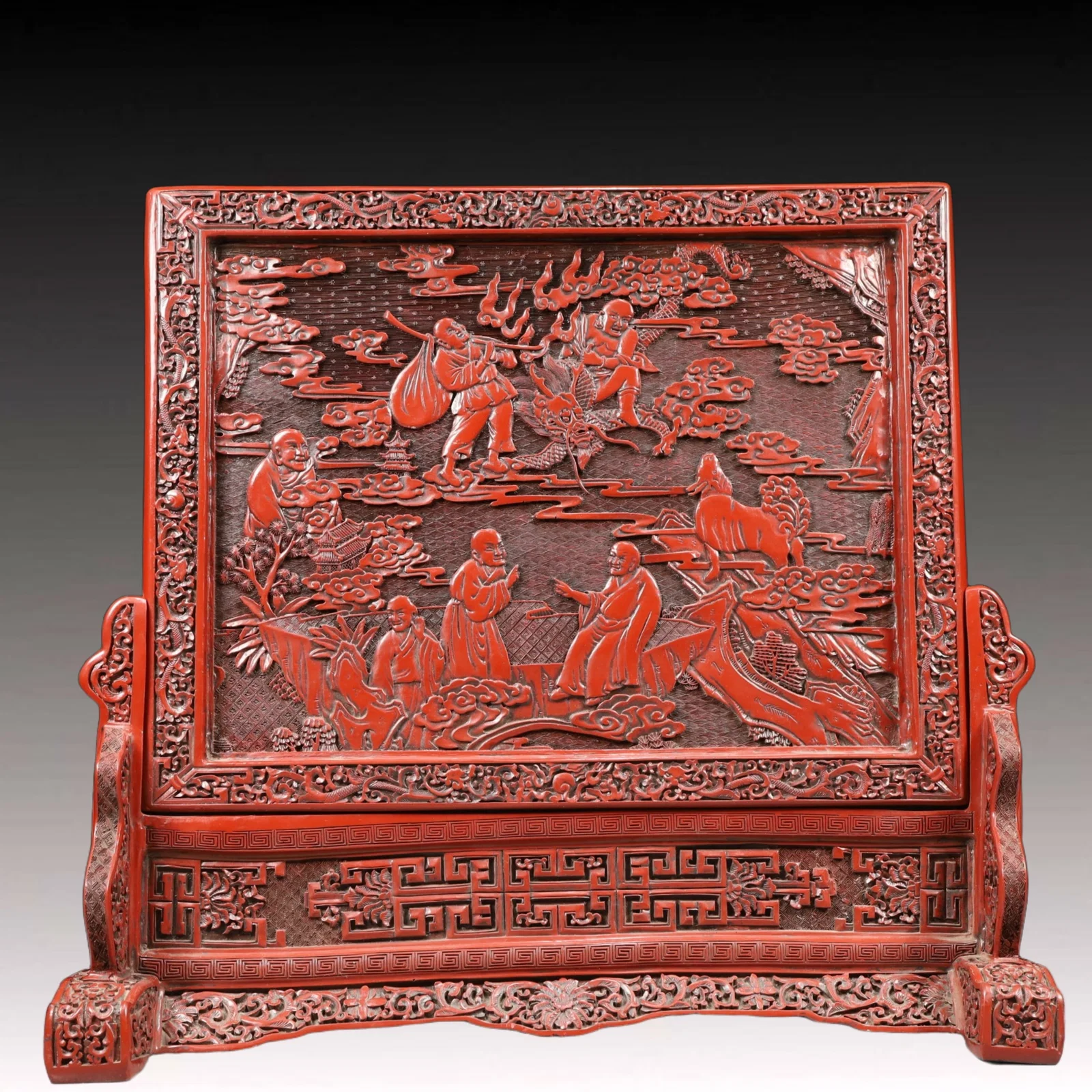 A Rare Carved Red Lacquer Arhat Pattern Table Screen