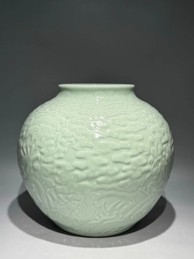 A Rare Celadon Glazed Auspicious Cloud and Dragon Pattern Jar