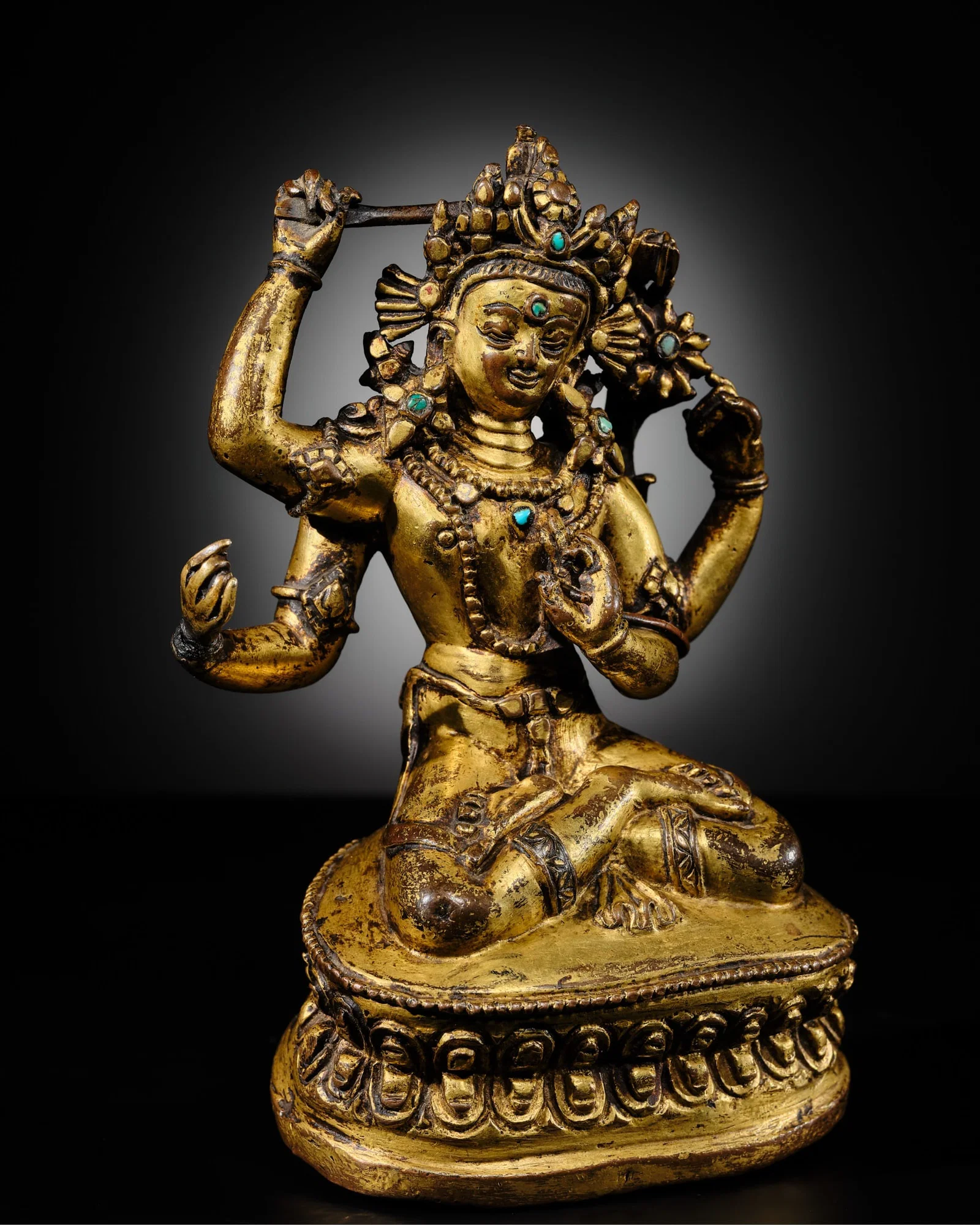 A RARE GILT-BRONZE FIGURE OF MANJUSHRI NAMASANGITI, NEPAL, 14TH-15TH CENTURY