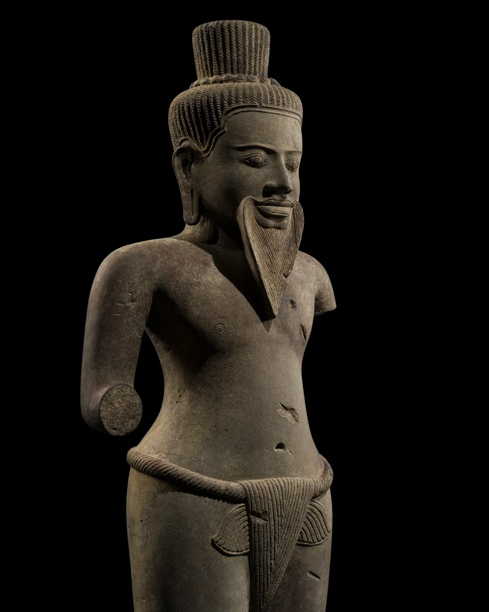 A RARE SANDSTONE IMAGE OF THE ASCETIC SHIVA, ANGKOR WAT STYLE, 12TH-13TH CENTURY