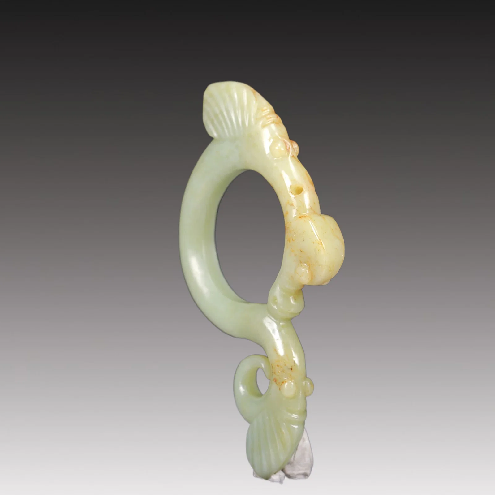 A Rare White Jade Auspicious Beast Pendant
