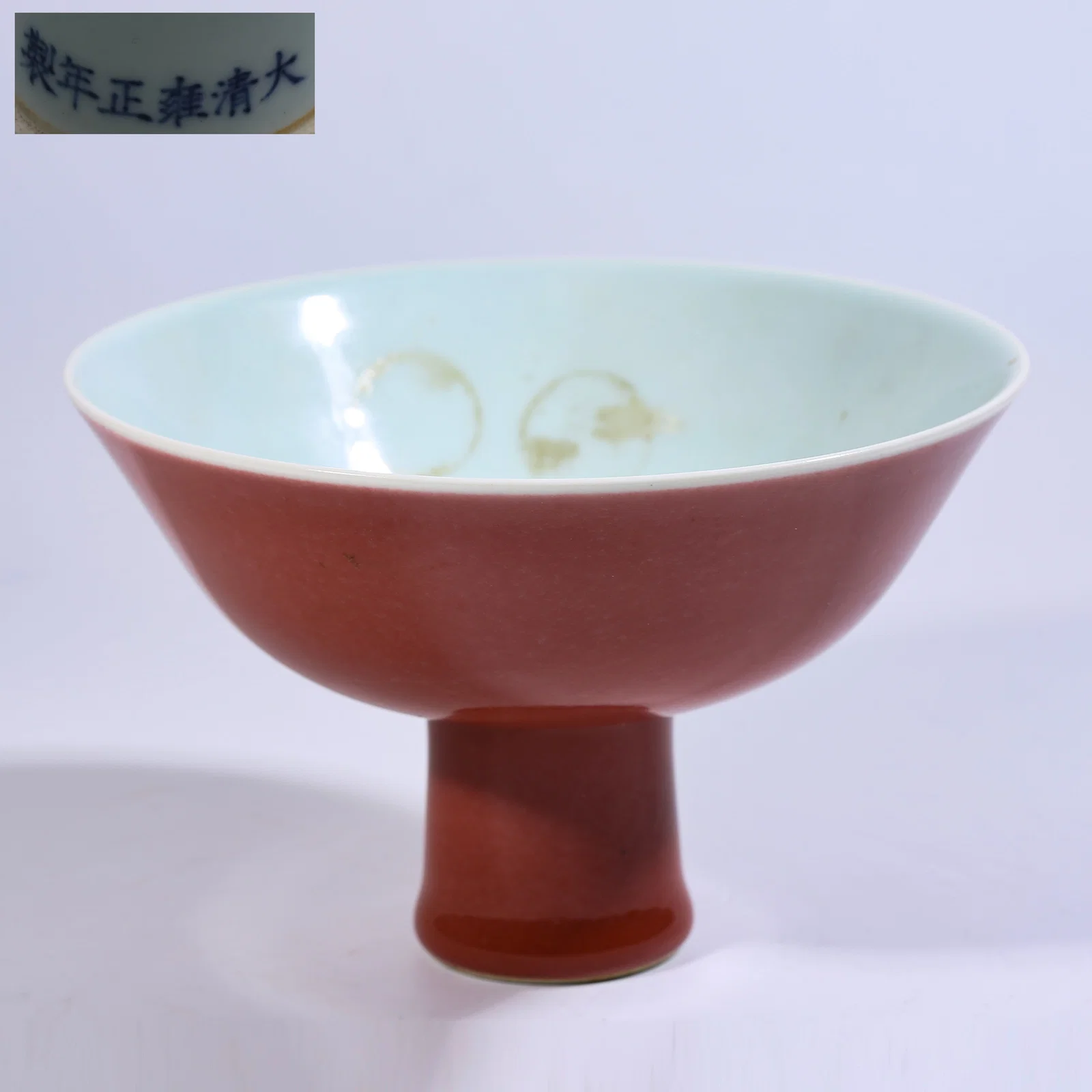 A RED-GLAZED HIGH-FOOT BOWL
