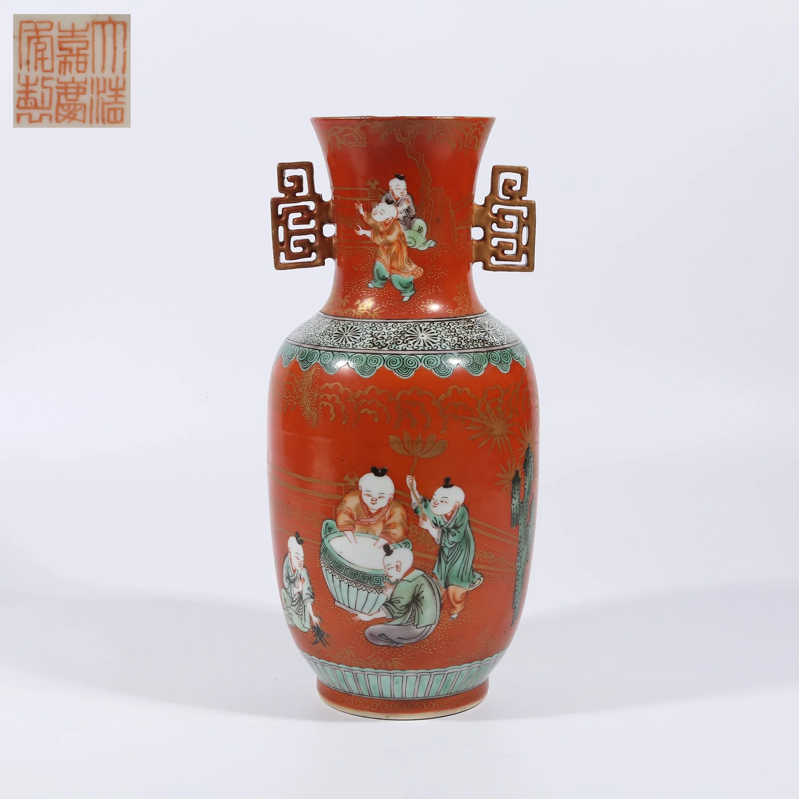 A RED-GROUND FAMILLE ROSE DOUBLE-HANDLED VASE WITH BOYS AT PLAY DESIGN