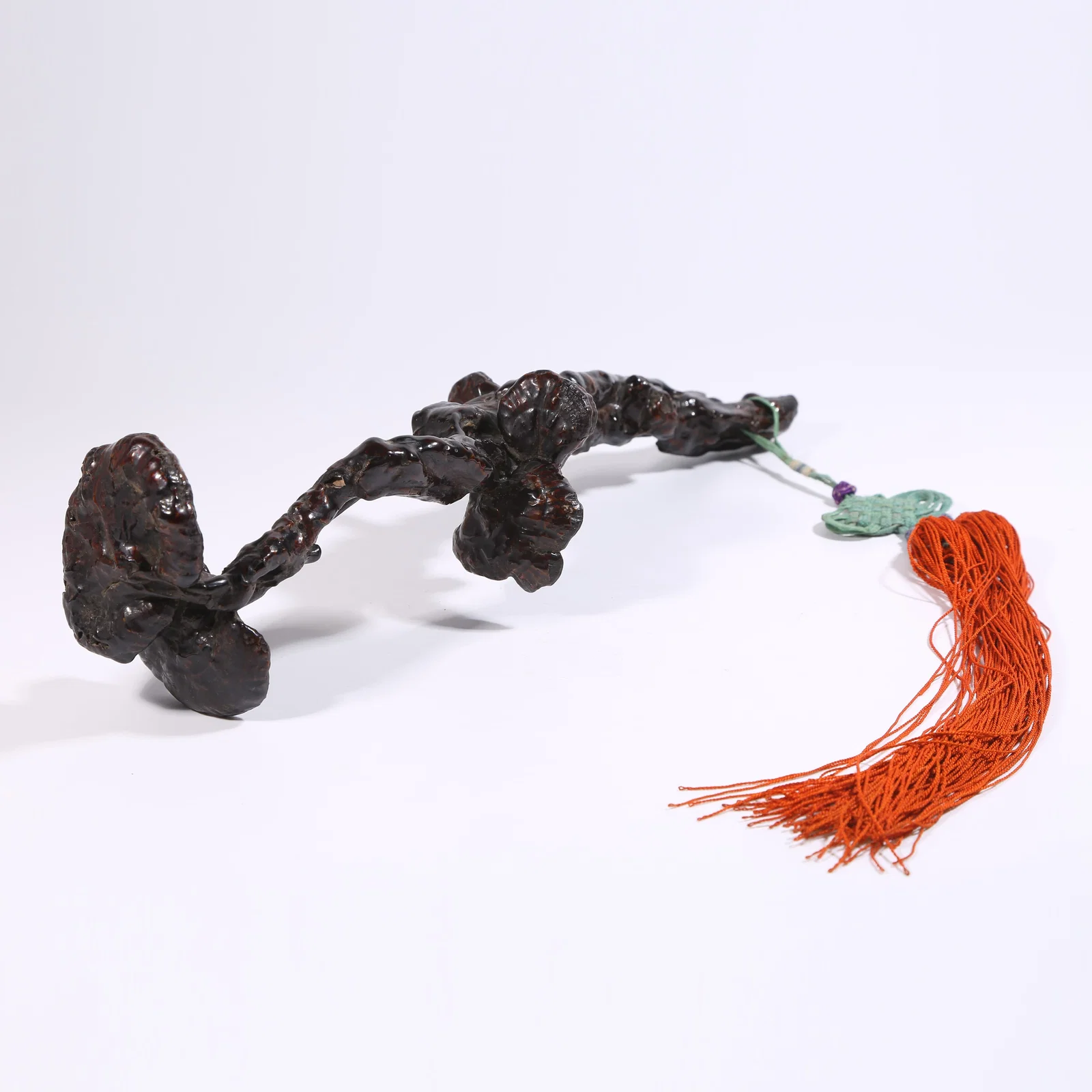 A REDWOOD LACQUER RUYI WITH LINGZHI PATTERN