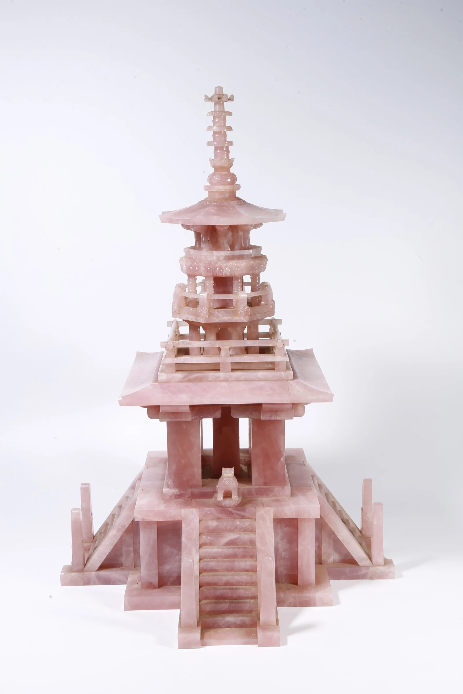 A ROSE QUARTZ CARVED BUDDHA PAGODA