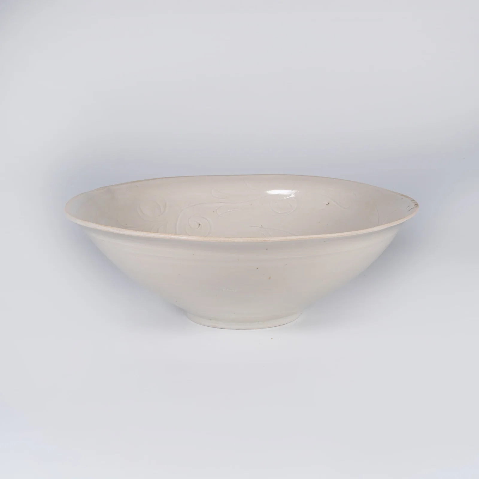 A RU WARE BOWL WITH CARVED FLORAL DESIGN