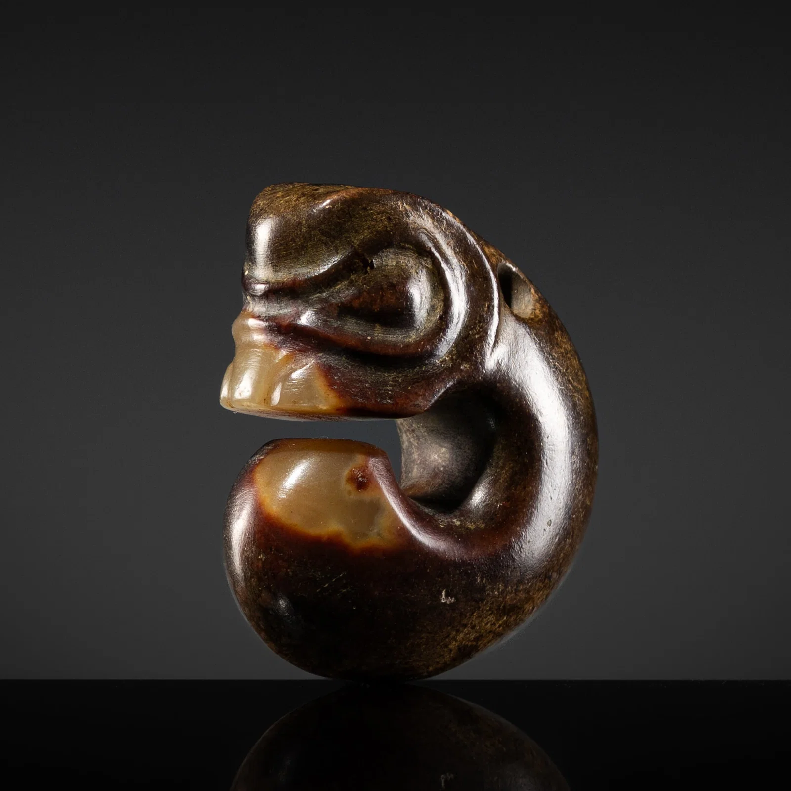 A RUSSET-BROWN AND YELLOW JADE 'PIG-DRAGON' PENDANT, ZHULONG, HONGSHAN CULTURE