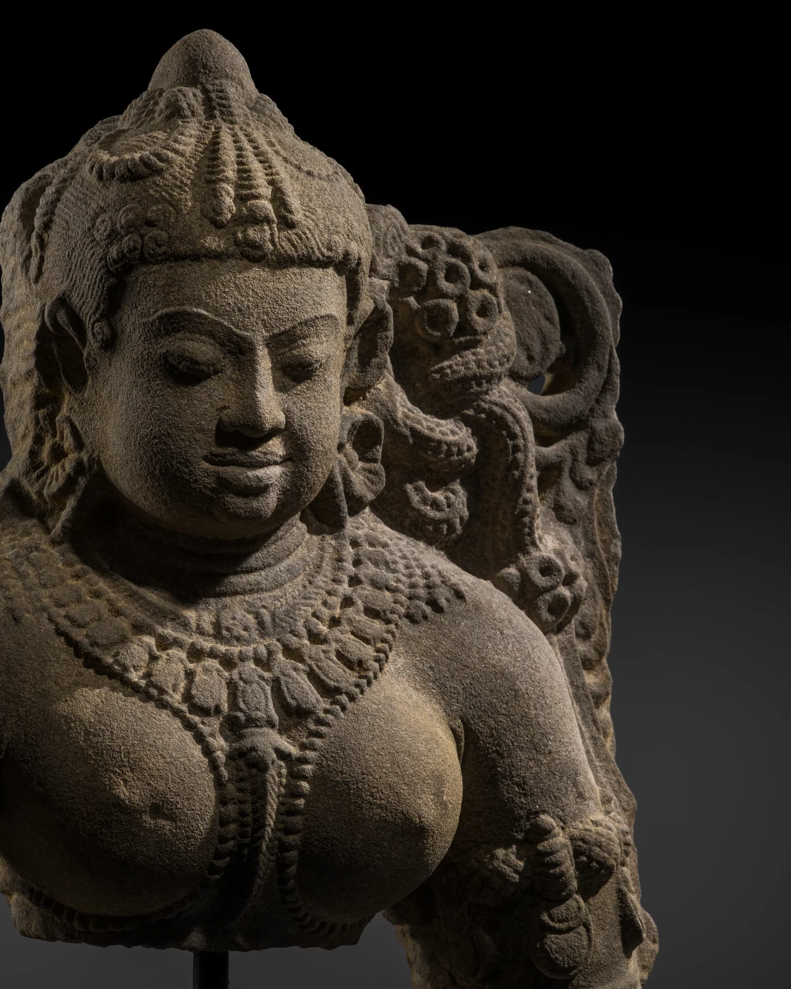 A SANDSTONE BUST OF A GODDESS, RAJASTHAN OR MADHYA PRADESH, 11TH-12TH CENTURY