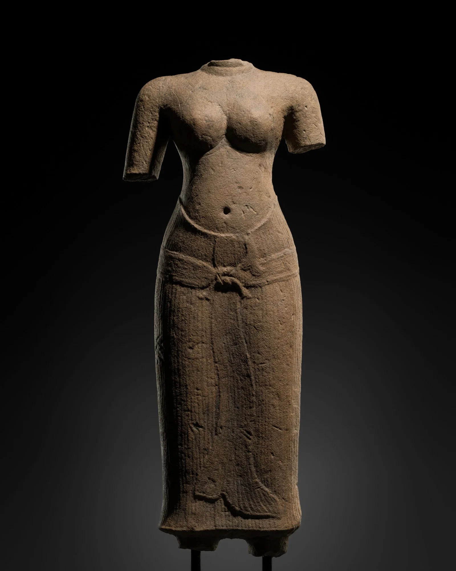 A SANDSTONE TORSO OF UMA, ANGKOR PERIOD, BAPHUON STYLE, 11TH CENTURY