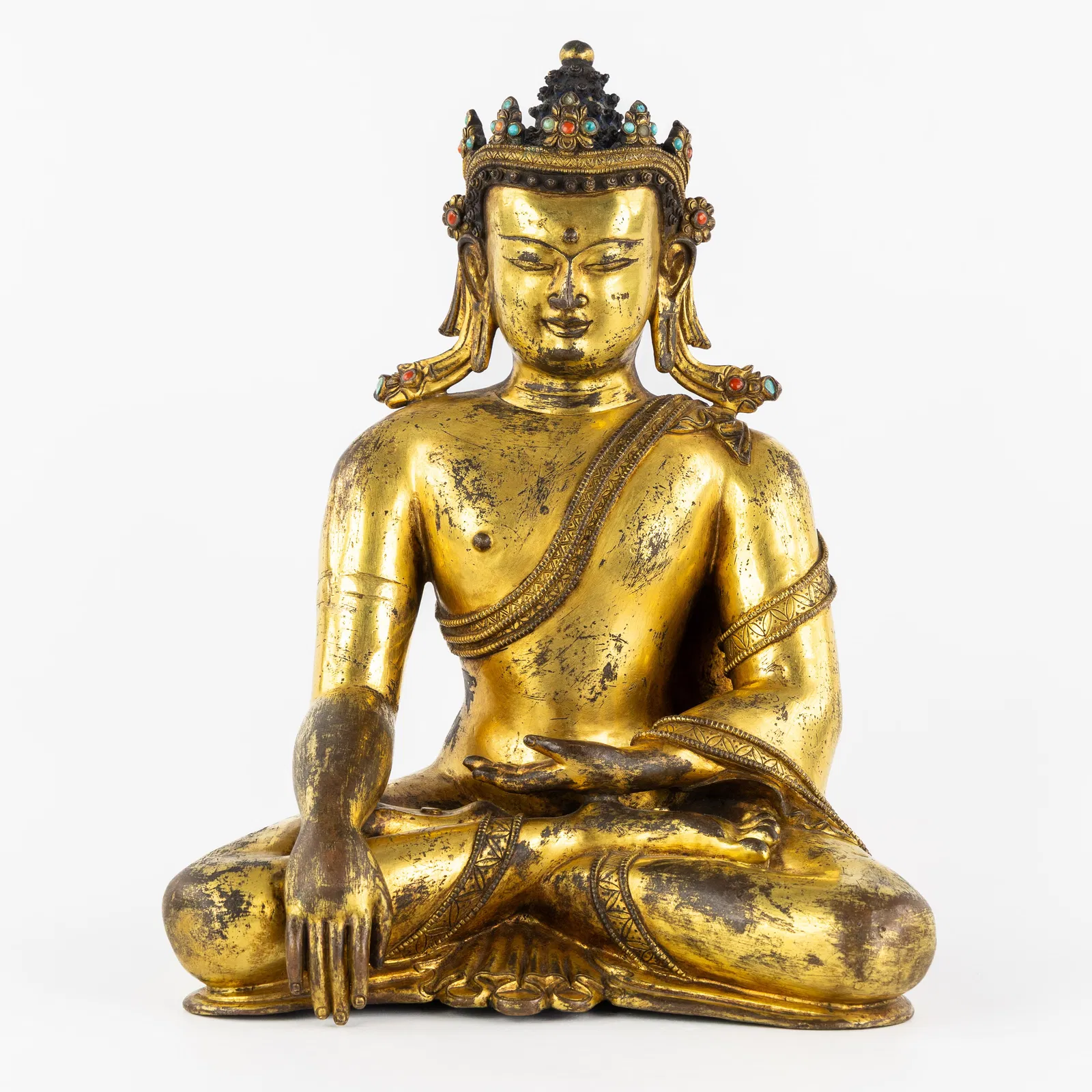 A Seated Akshobhya Buddha, gilded bronze, decorated with coral and turquoise cabochons, Ming