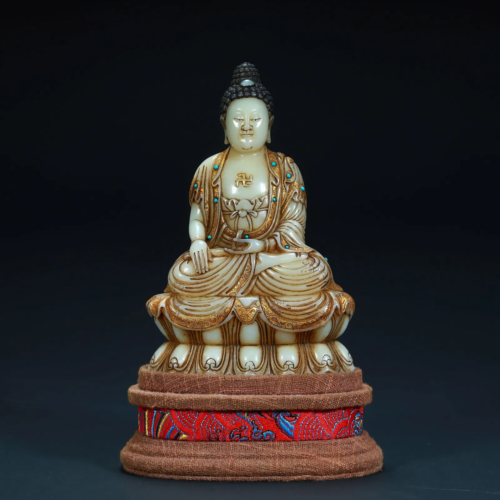 A seated statue of Amitabha Buddha painted with gold painted on Shoushan stone in the Qing Dynasty