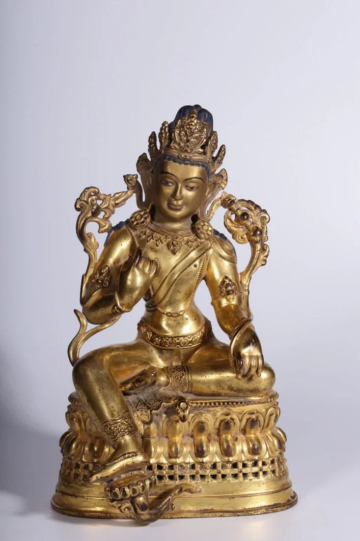 A seated statue of Tara, a bronze gilt green Tara, from the Qing Dynasty
