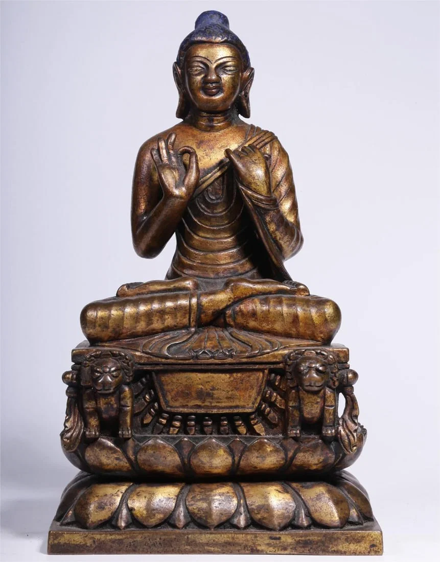 A seated statue of the Great Sun Buddha in the style of copper gilt swat in the Qing Dynasty