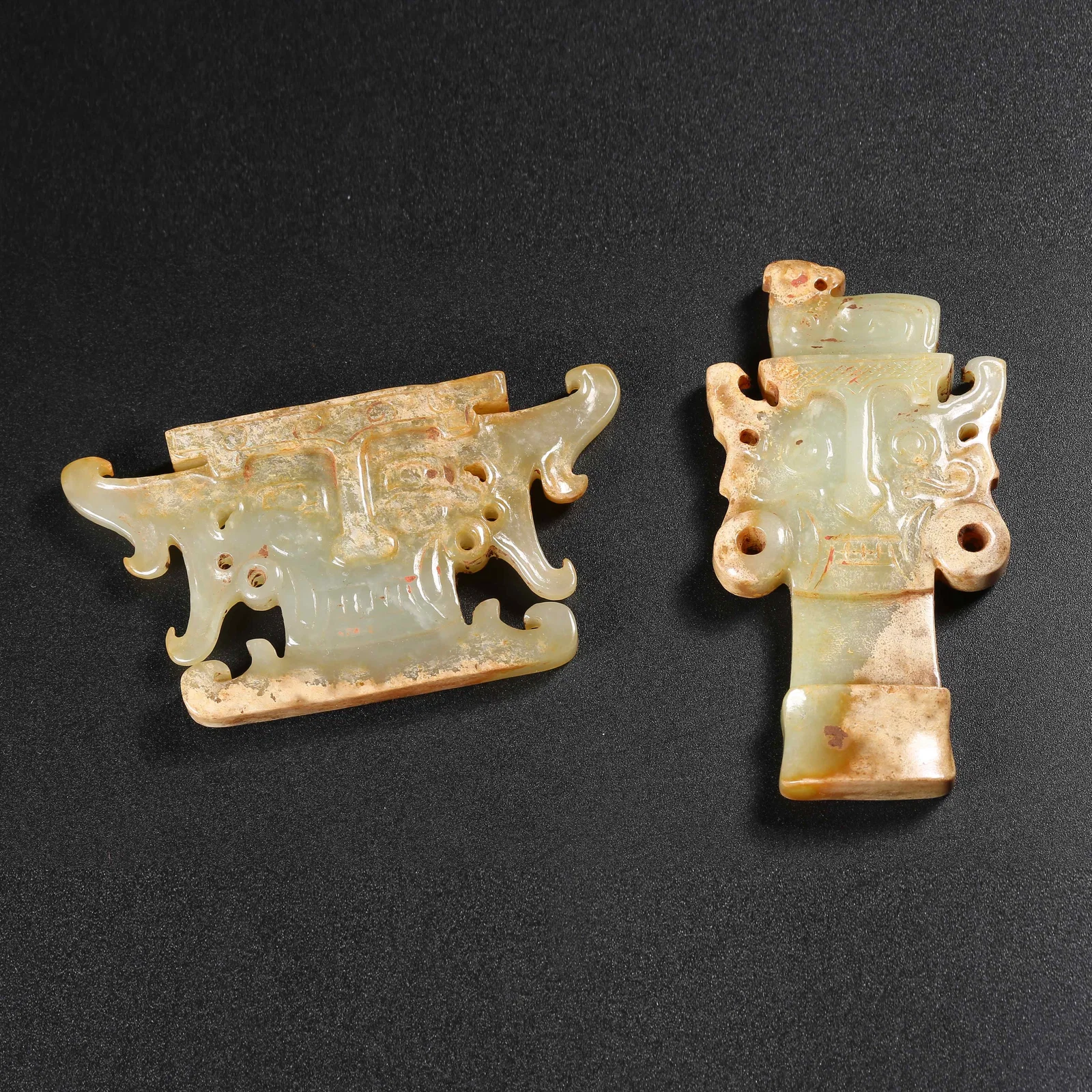 A SET OF ANCIENT JADE MASKS OF DEITIES