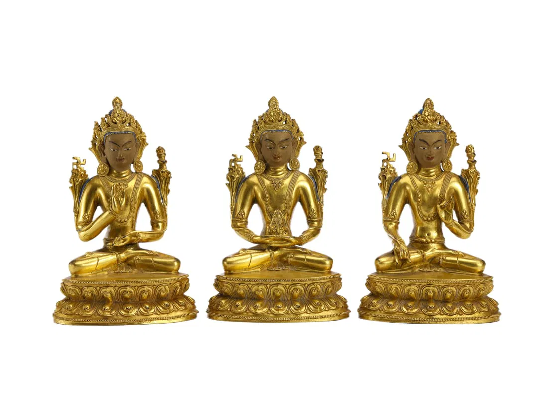 A SET OF BRONZE-GILT TRINITY BUDDHAS