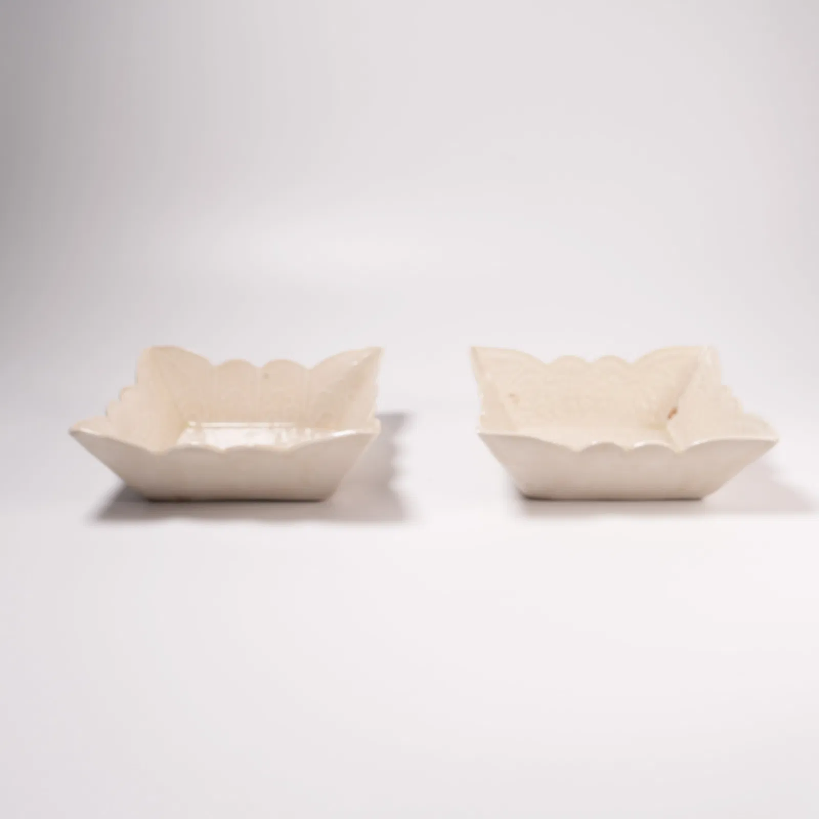 A SET OF DING WARE FOLIATE-RIM WASHERS WITH INCISED BUTTERFLY MOTIF