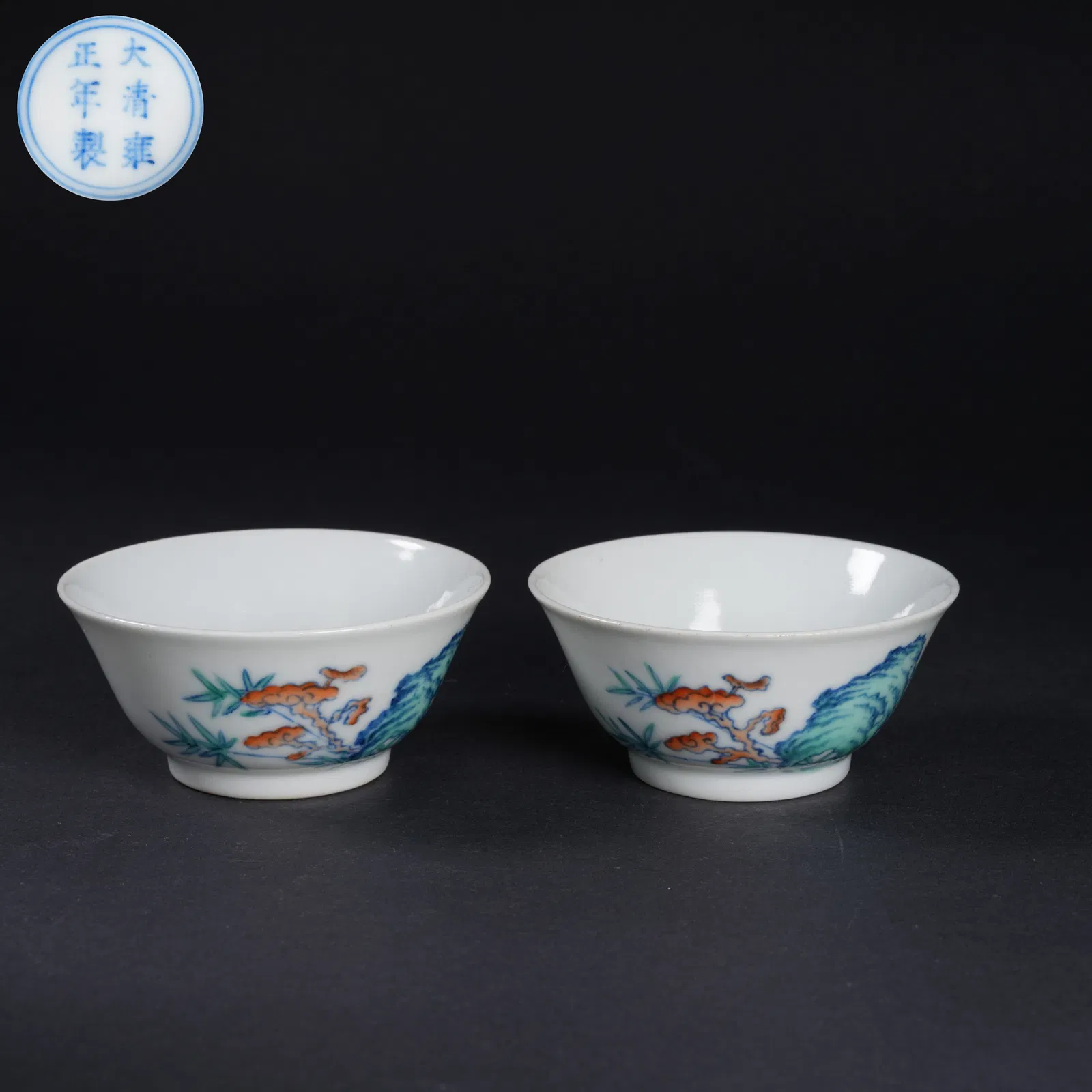 A SET OF DOUCAI "LONGEVITY MOUNTAIN AND LINGZHI" MOTIF CUPS