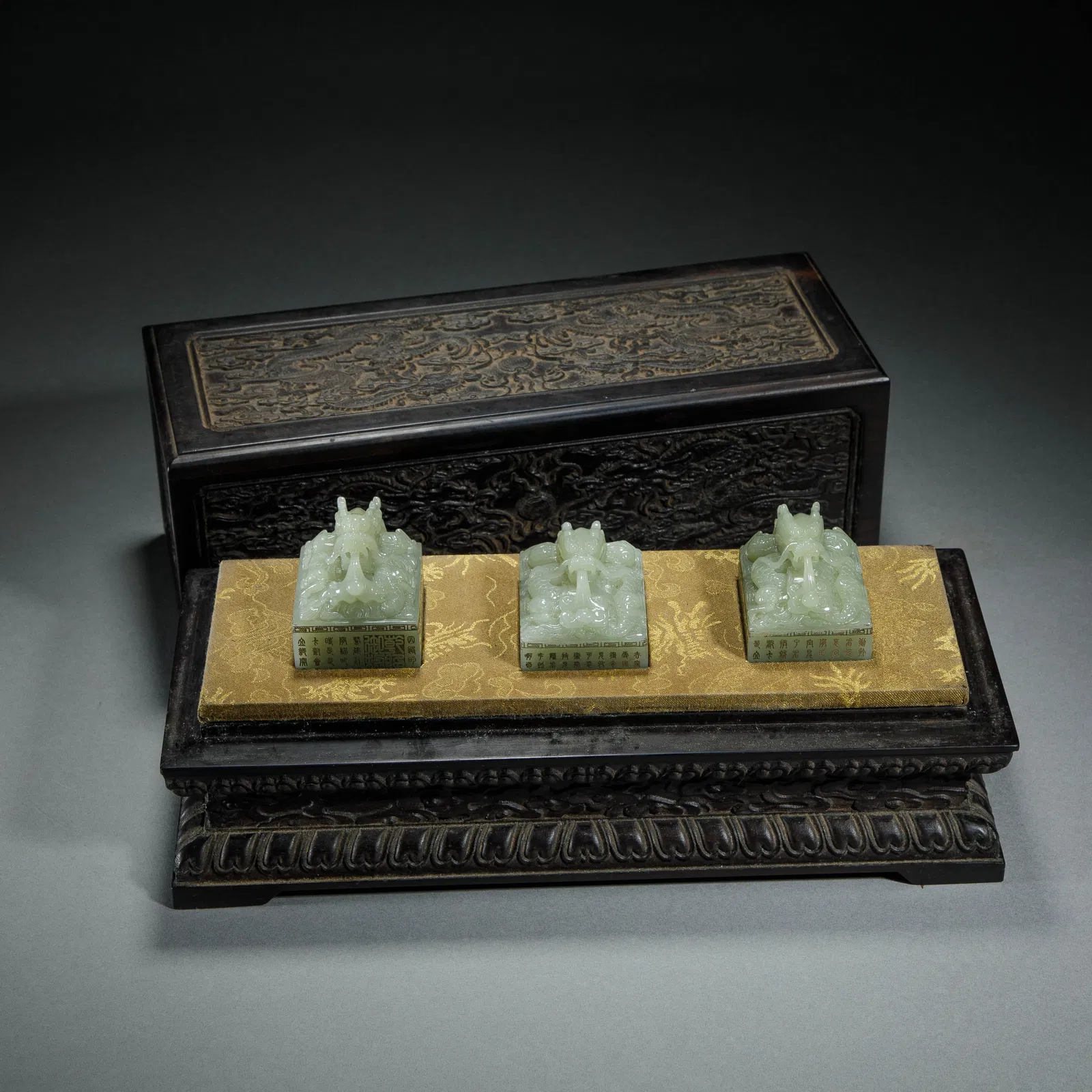 A SET OF FINE CARVED WHITE JADE DRAGON SEALS