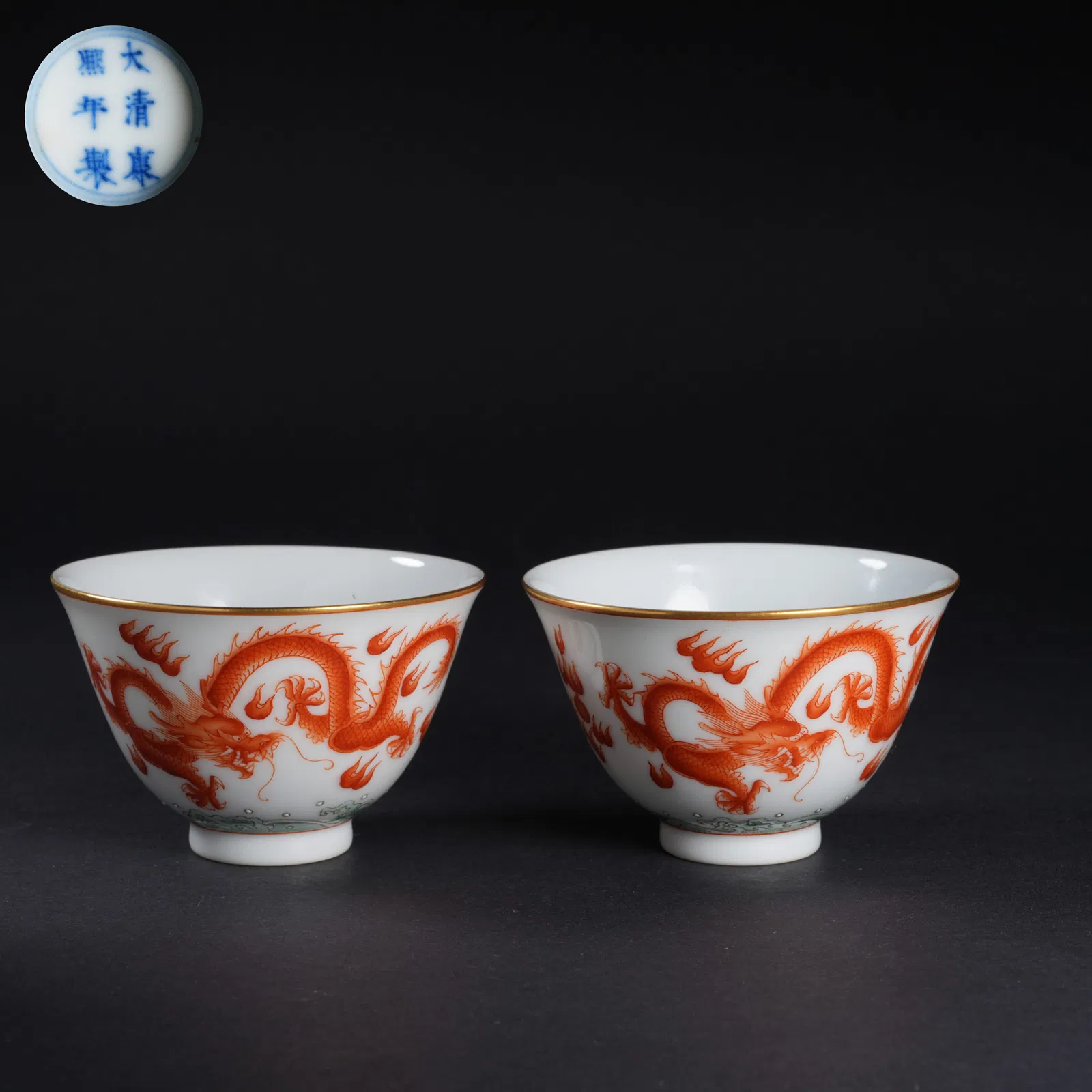 A SET OF IRON-RED "DRAGON AMID WAVES" CUPS
