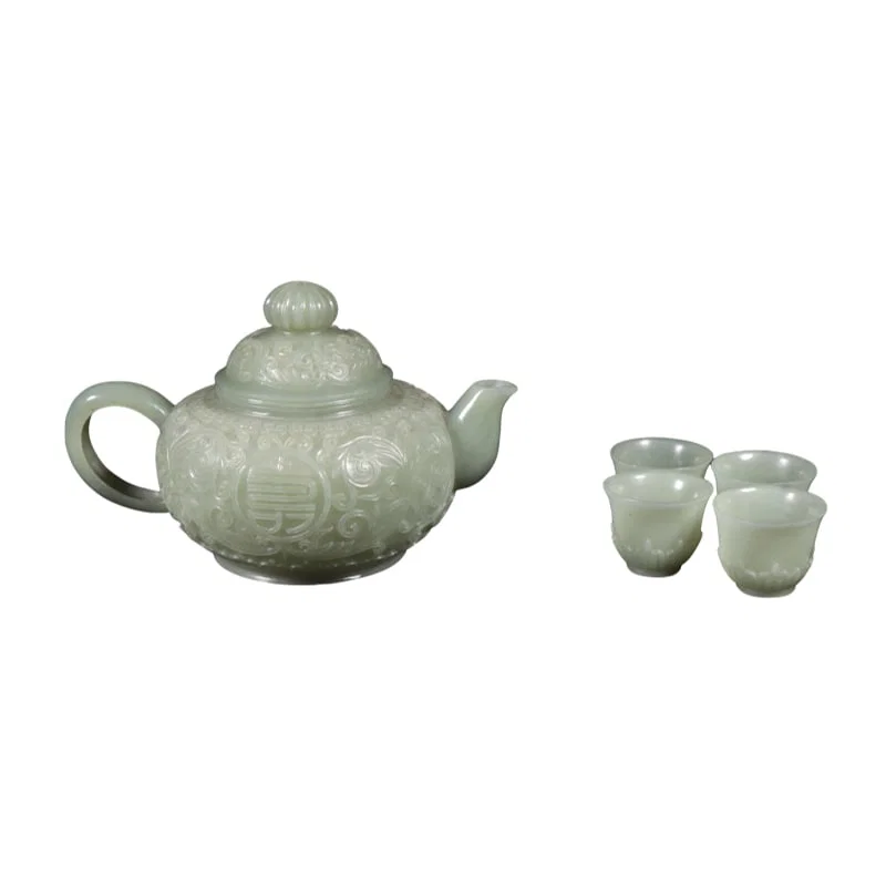 A set of one Hetian jade teapot with four cups.