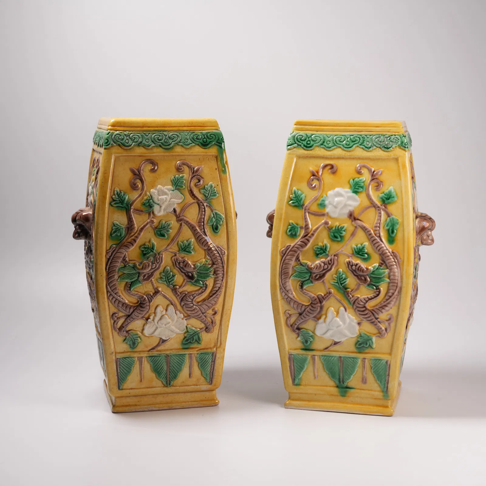 A SET OF PLAIN SANCAI VASES WITH DRAGON MOTIF AND BEAST-HEAD HANDLES