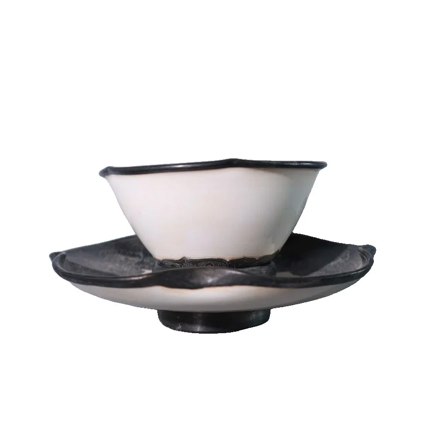 A set of tea cups with flower patterns carved in silver on Ding kiln porcelain from the Song