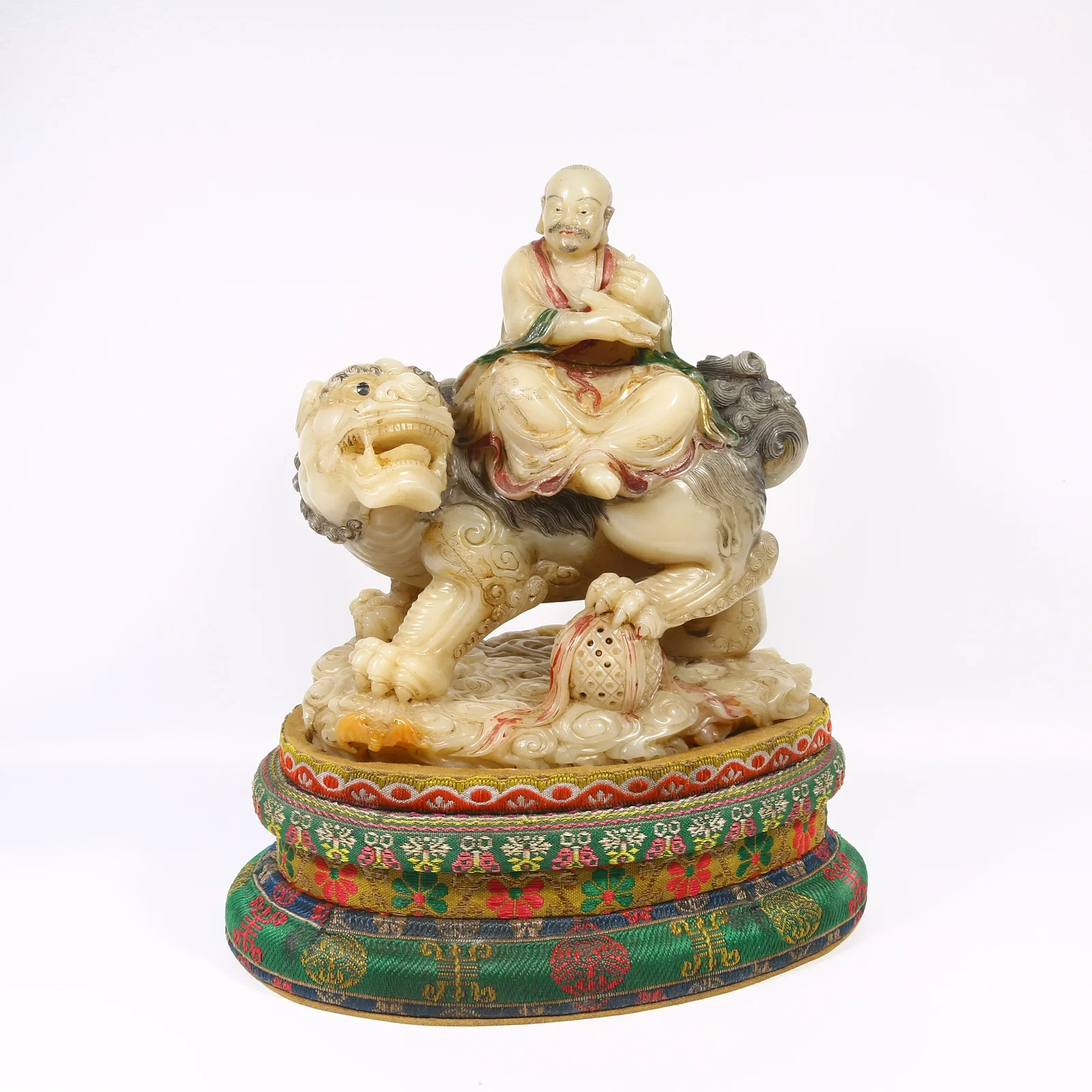 A SHOUSHAN FURONG STONE POLYCHROME ARHAT ORNAMENT