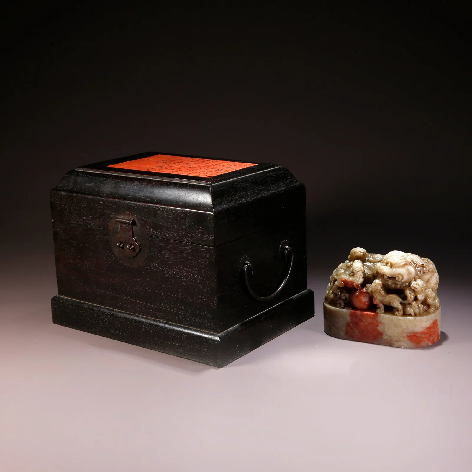 A SHOUSHAN STONE CARVED SEAL WITH LION PLAYING WITH BALL HANDLE